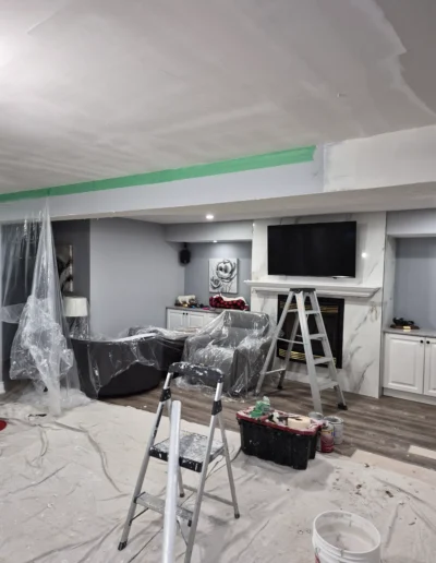 Home improvement contractor repairing walls and ceiling