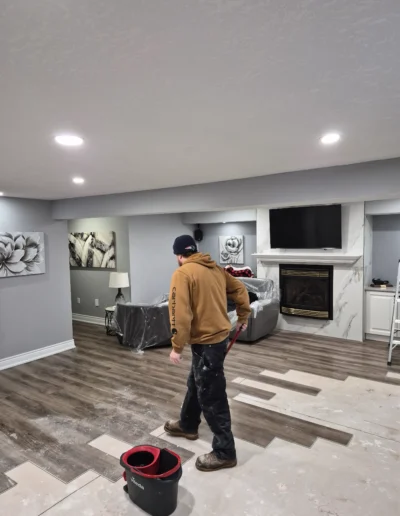 Skilled contractor installing drywall during renovation
